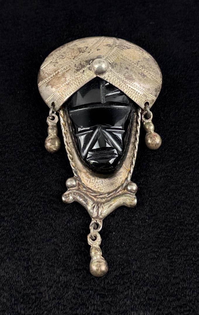 Taxco Sterling Silver Onyx Blackamoor Brooch: 21.20 grams. 2 5/8" by 1 3/8" by 1/2".