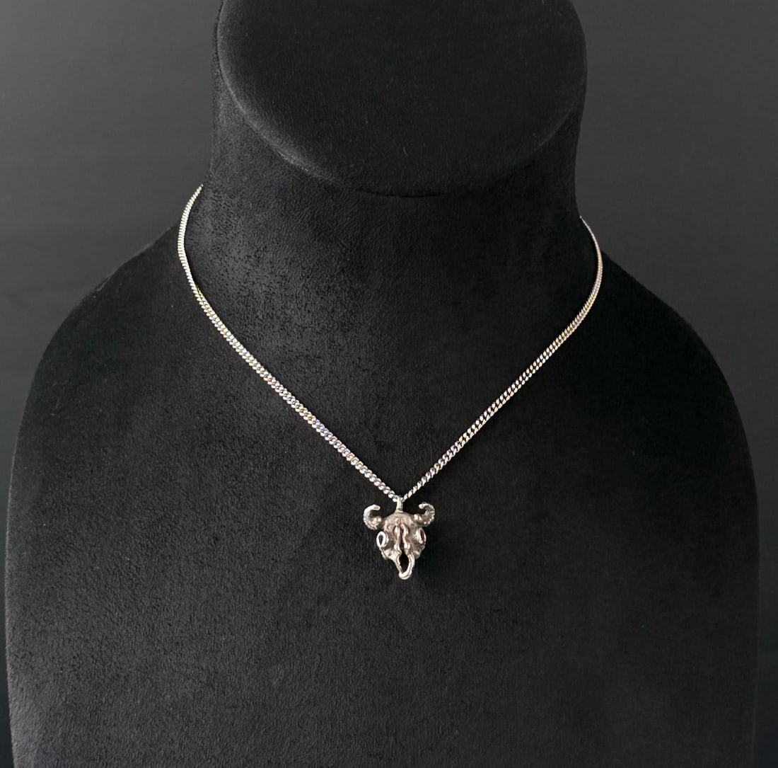 Sterling Silver Buffalo Skull Necklace: 8.84 grams. 9" long as displayed.