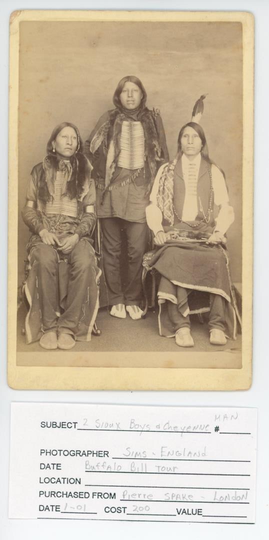 Buffalo Bills Wild West Show Indian Cabinet Photo: Photographer is Sims of London. Title is Two Sioux Boys, and Cheyenne Man. Indians identified as Good Eagle, Acsala, Blue Rainbow.