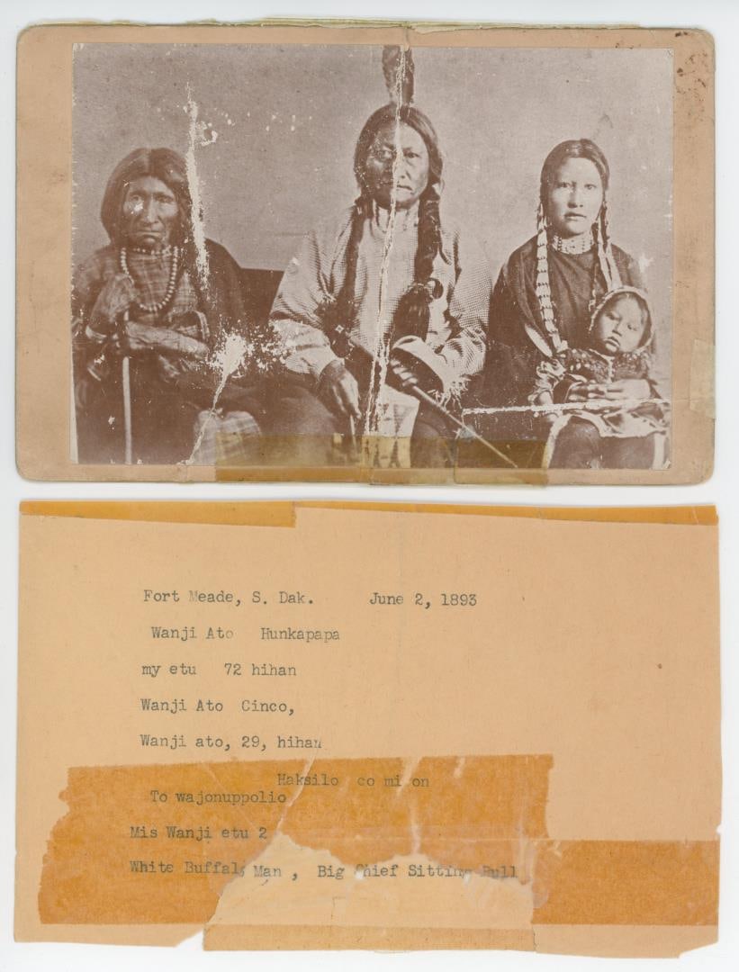 Chief Sitting Bull and Family Cabinet Indian Photo: 4 1/4" by 6 1/2". Cabinet card portrait of Sitting Bull with members of his family, including his mother, Her Holy Door, and his eldest daughter, Many Horses, with her son on her lap. Originally taken