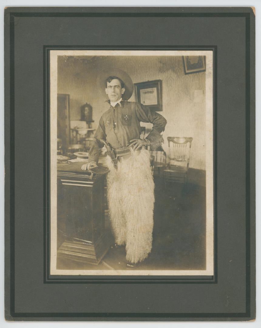 Cowboy Gunfighter in Wooly Chaps Photo: 8" by 10". Unidentified subject.