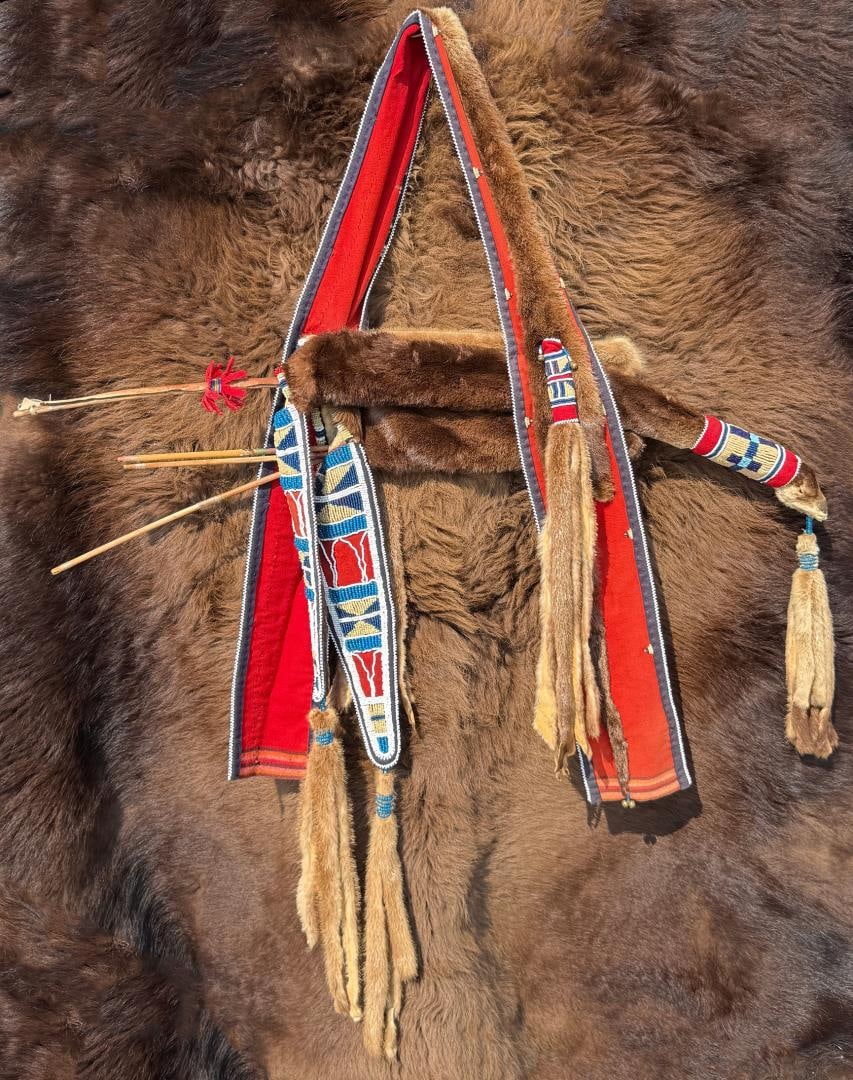 Crow Native American Indian Otter Bow Case: First Half of the 20th Century. 44 1/2" by 45 1/2" by 60" as displayed with bow.