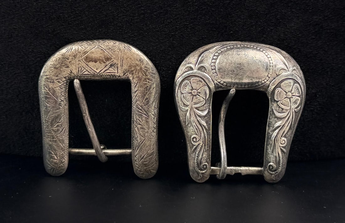 Pair of Sterling Silver Cowgirl Belt Buckles: Larger of the two measures 1 7/8" by 2". 43.51 grams total.