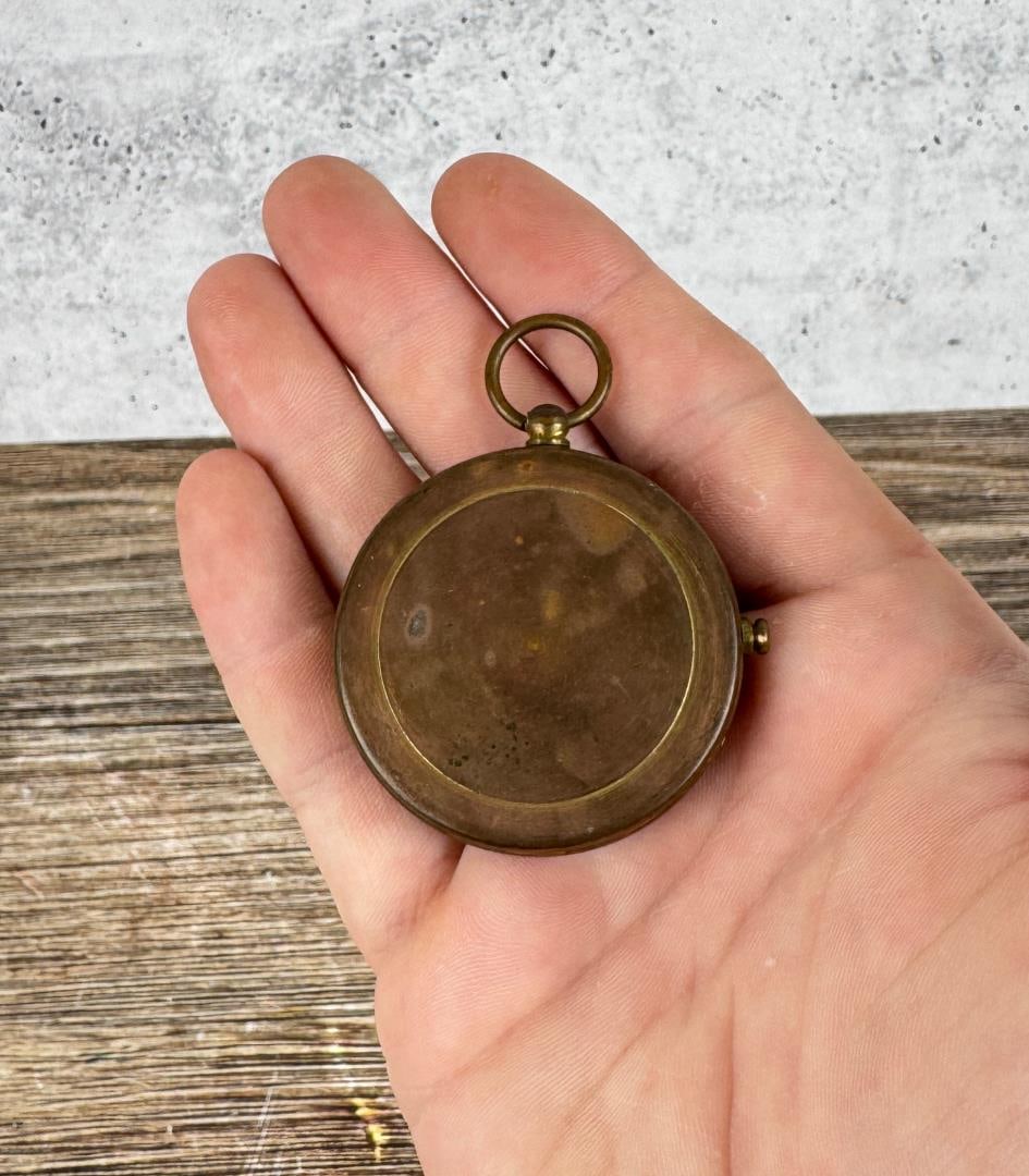 German Brass Pocket Compass: 1 7/8" by 2 1/4".