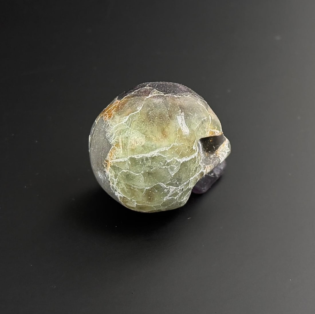 Fluorite Skull Carving: 1 1/8" by 1 3/8" by 1 7/8". 101 grams.