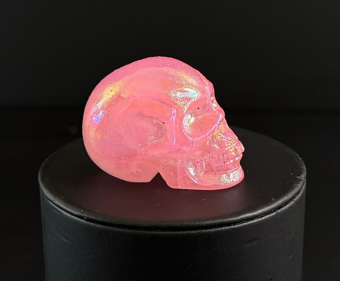 Aura Quartz Skull Carving: 1 1/4" by 1 3/8" by 1 7/8". 68.78 grams.