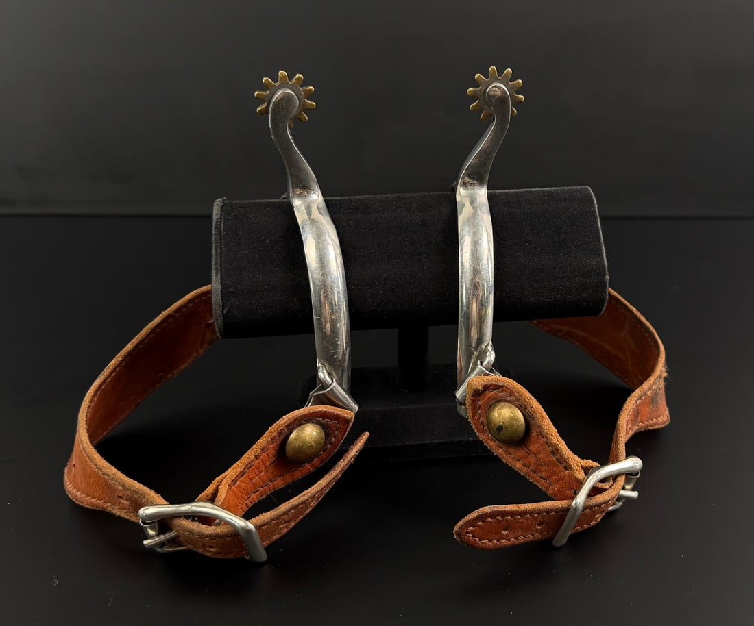 Montana Cowboy Spurs: Made in Korea. 7 3/4" long with strap.
