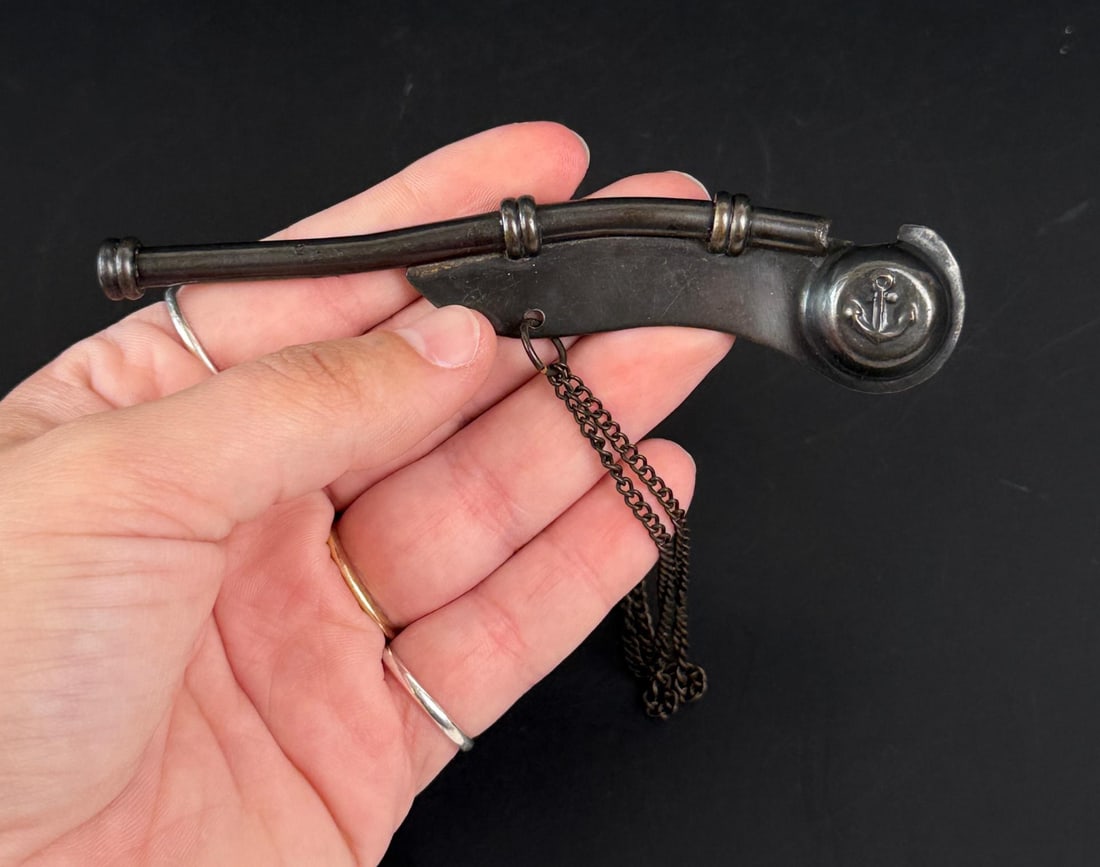 Boatswain Naval Whistle: Comes in a wooden box with velvet lining. Whistle is 5 1/2" long.