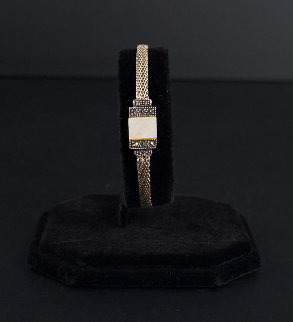 Sterling Silver Marcasite Mother of Pearl Bracelet: 7" inner circumference. 7.47 grams total.
