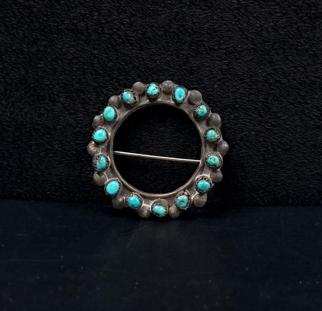Zuni Sterling Silver Turquoise Snake Eye Brooch: 1 1/8" diameter. 4.11 grams.
