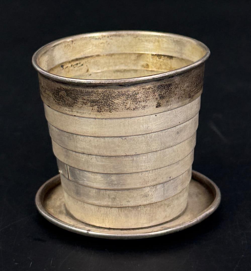Sterling Silver Telescopic Folding Travel Cup: 2 1/2" diameter, 1 7/8" tall. 63.38 grams.