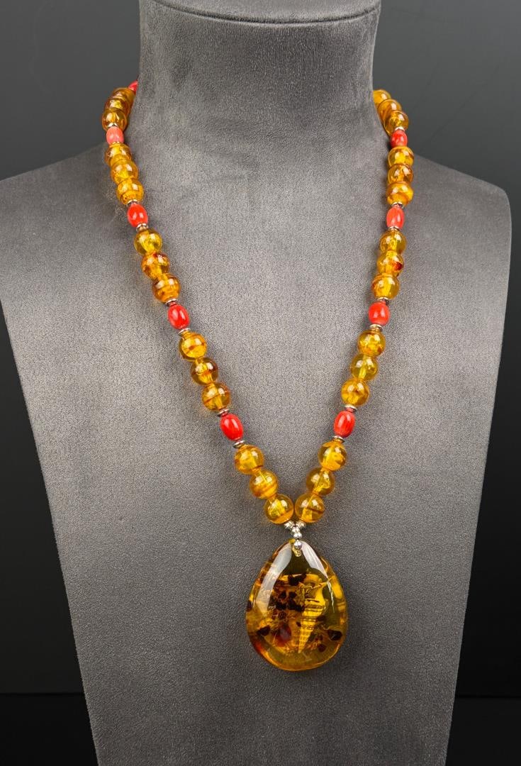 Baltic Amber Seashell Necklace: 14 5/8" long as displayed. 75 grams.