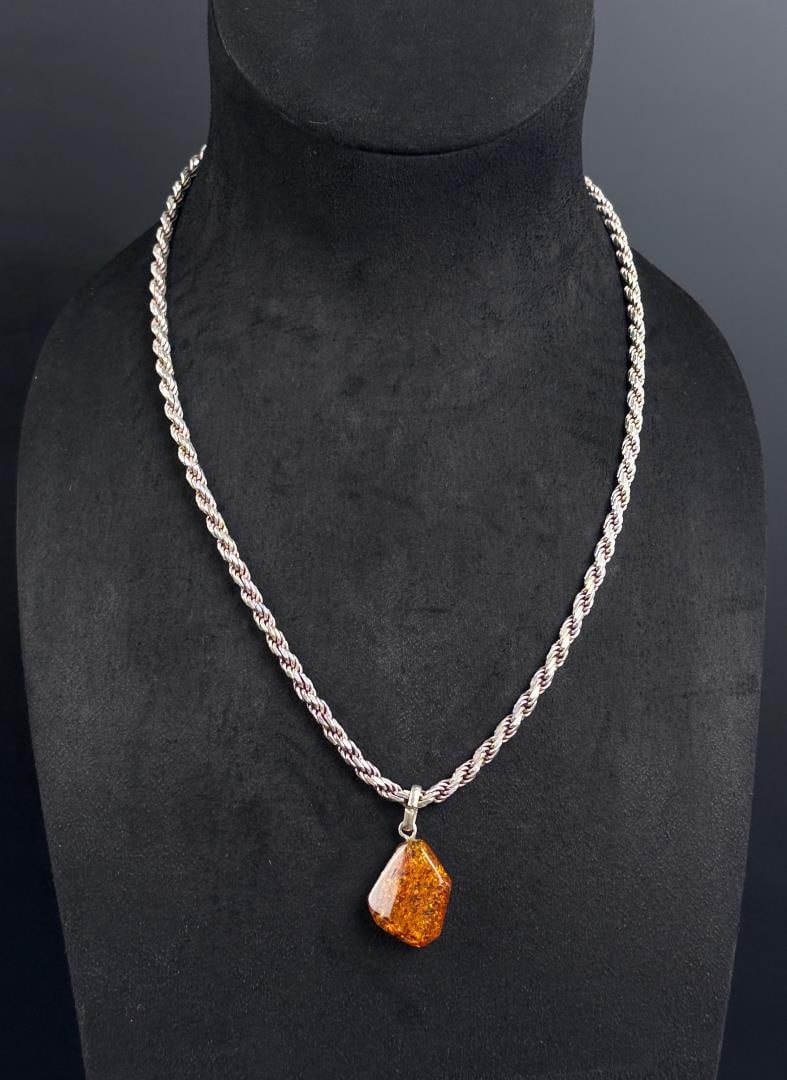 Sterling Silver Baltic Amber Necklace: 46.29 grams. 12 1/2" long as displayed.