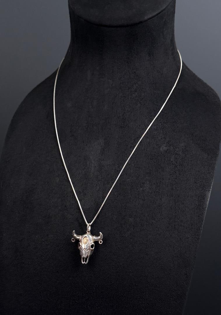 Sterling Silver Buffalo Skull Necklace: 12 1/2" long as displayed. 8.31 grams.