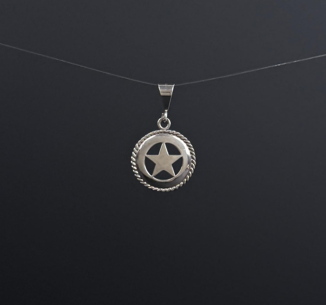 Ambriz Jewelry Sterling Silver Texas Star Pendant: 5.36 grams. 1 1/2" by 7/8" by 1/8".