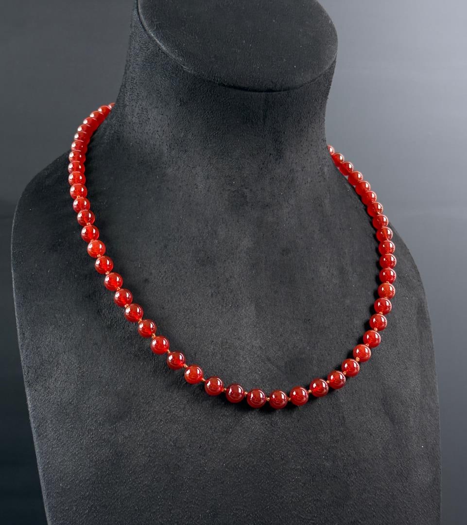 Carnelian Bead Necklace: 11 3/8" long as shown, 47.55 grams.