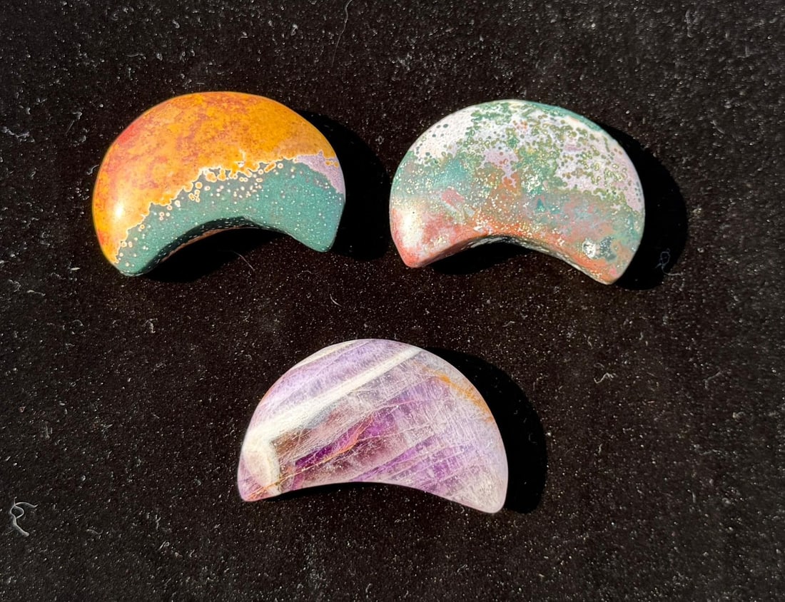 Group of Carved Stone Moons: Ocean Jasper and Chevron Amethyst. 153 grams total.
