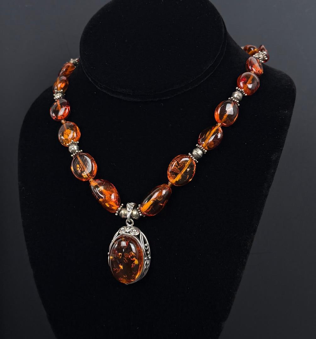 Sterling Silver Baltic Amber Graduated Necklace: 10 1/2" Long as displayed.