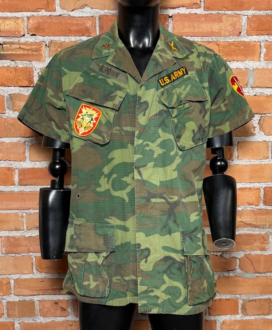 Vietnam War MACV SOG Camo Jungle Jacket: Nice example of the short sleeve variant. Dated 1969, Tagged a size Medium-Long. Named to a Major Brown who was sporting MACV SOG insignia.