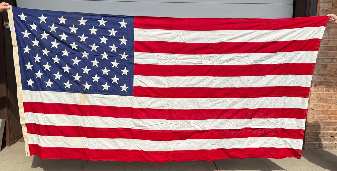 50 Star US American Flag: 57 1/2" by 115 1/2". Valley Forge Flag Company. Light stainage present.