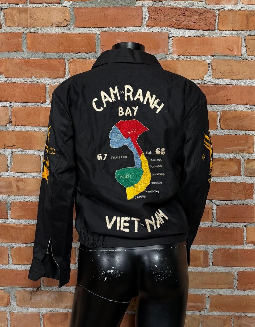 1967 Vietnam War Sukajan Souvenir Jacket: Jacket measures 18" from armpit to armpit and 22" length. The back features a colorful embroidered map of Camp Ranh Bay and yellow dragons on the sleeves with a tiger on the front breast.