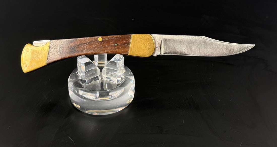 Buck 110 Two Line Inverted Pocket Knife: 4 3/4" long closed.