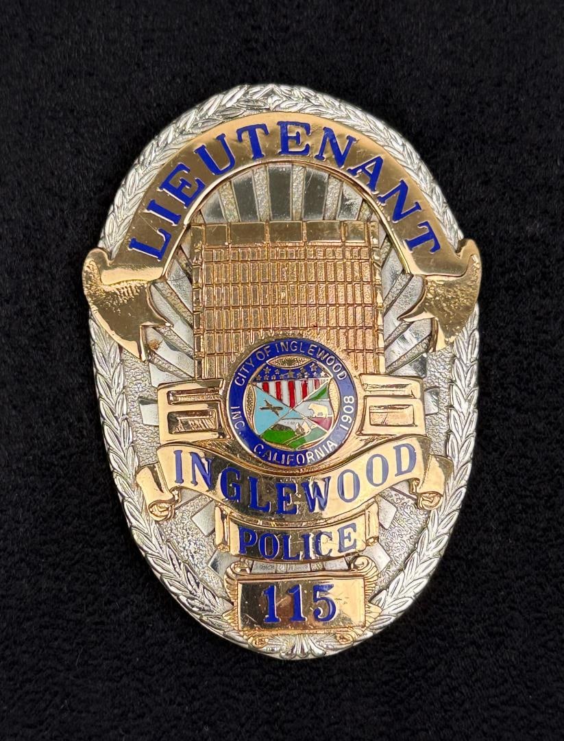 Inglewood California Lieutenant Police Badge: 2 3/8" by 3 3/8". Named to David Garza, Jr., Garza was a long-serving Latino lieutenant in the Inglewood Police Department who filed a prominent employment discrimination lawsuit against the city in t