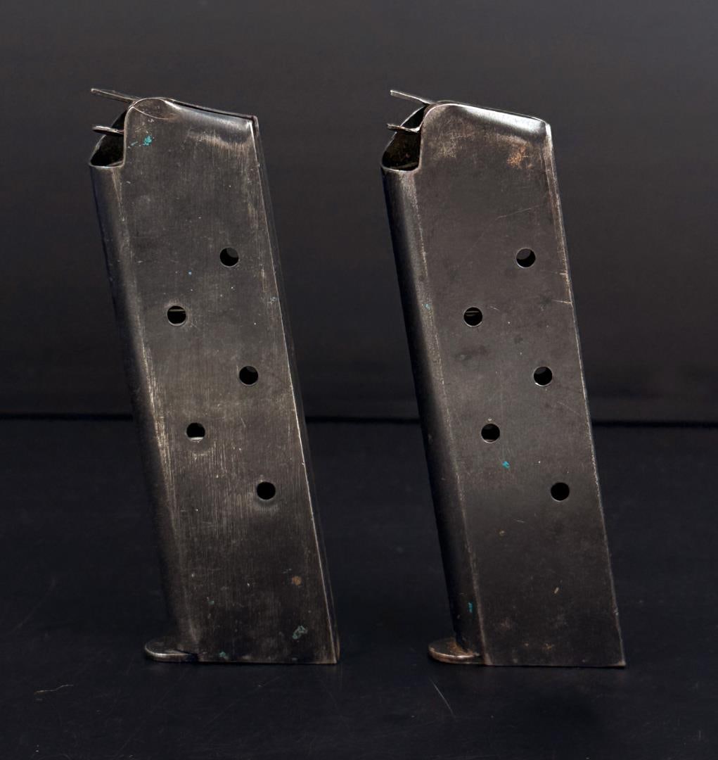 WW2 Colt 1911 M1911 Pistol Magazines: One Risdon stamp, one unmarked. Later war variants.