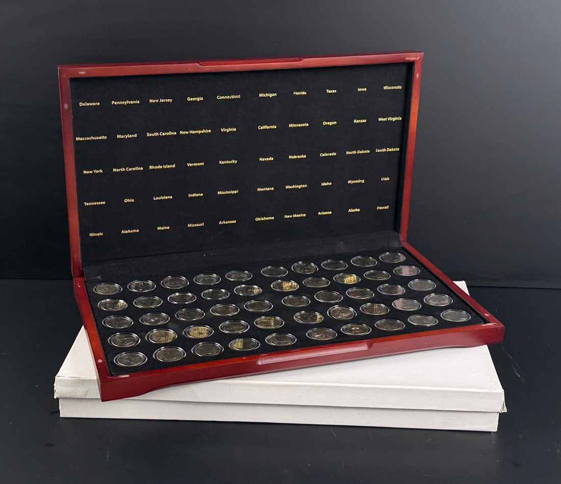 Collection of 50 State Quarters: 50 total in display.