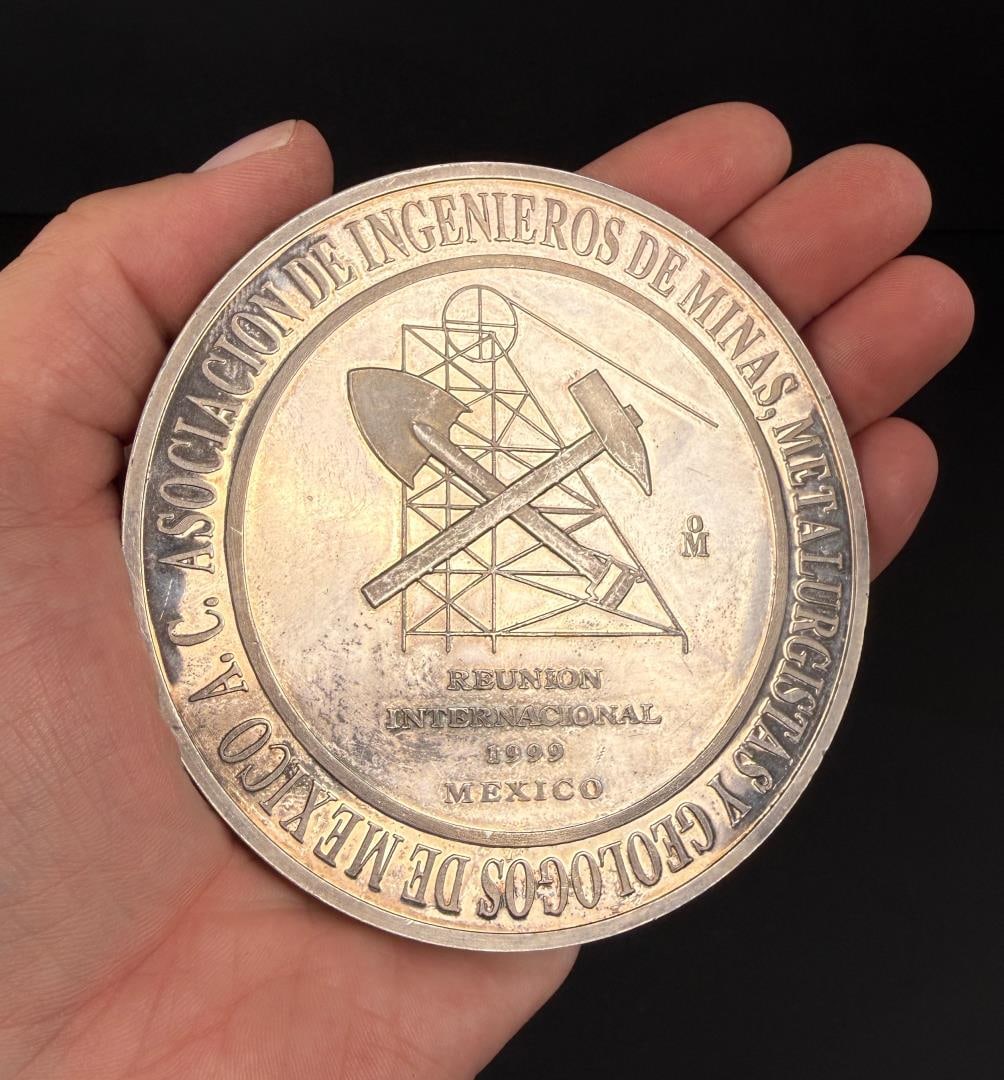1999 Mexico Mining Engineers 10 Ounce Silver Coin: 1999 International Reunion for the Association of Mining Engineers, Metallurgists and Geologists of Mexico. Mexico City Mint. 311.8 grams or 10 troy ounces. .999 pure silver. Lot requires payment via 