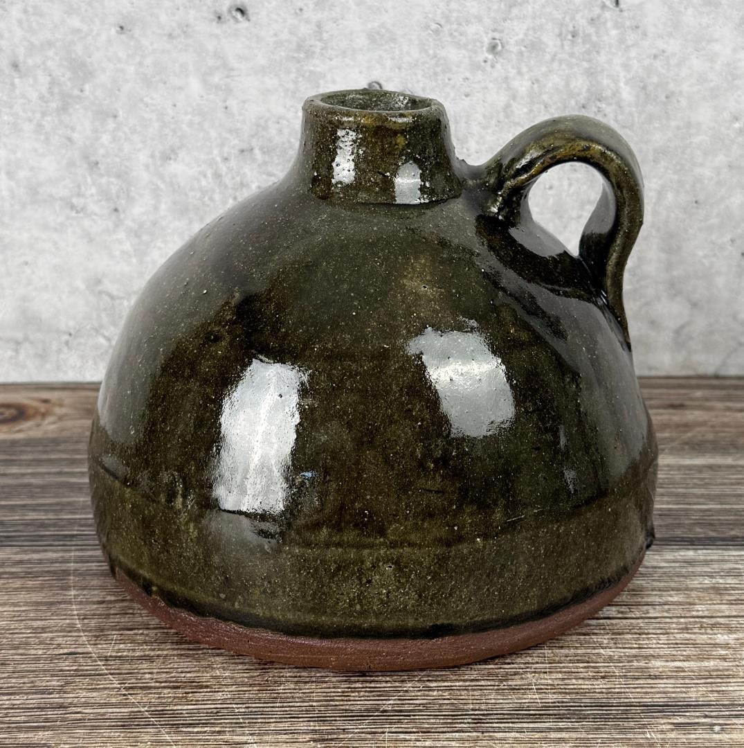 Chester Hewell Folk Art Pottery Jug: 6 1/4" diameter, 5" tall. Chester Hewell (b. 1950) is a fifth-generation folk potter from Gillsville, Georgia, descended from a family that has produced pottery in northeast Georgia since before the C