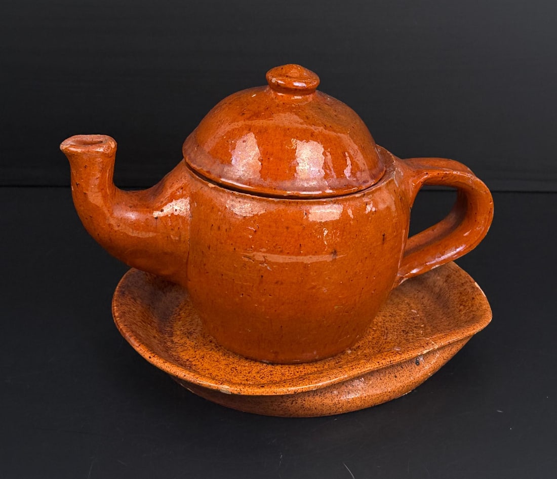 Jugtown North Carolina Redware Teapot: Teapot is 4 7/8" by 5 7/8" by 8 1/8". Comes with underplate. Plate is cracked.