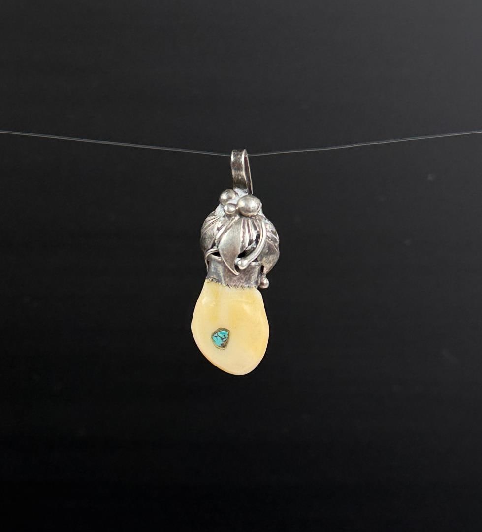 Navajo Sterling Silver Turquoise Elk Tooth Pendant: 1 5/8" long. 7 grams.
