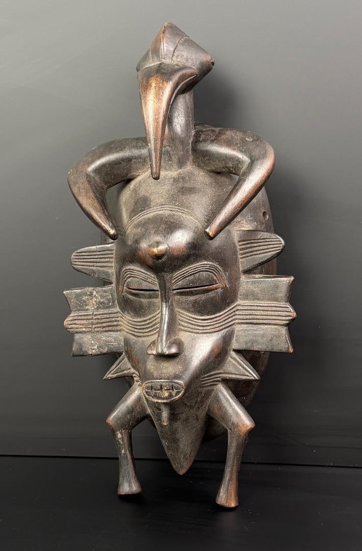 Ivory Coast Africa Senufo Kpelie Mask: 12" by 6" by 3 1/2". Exhibits age and old repairs as shown.