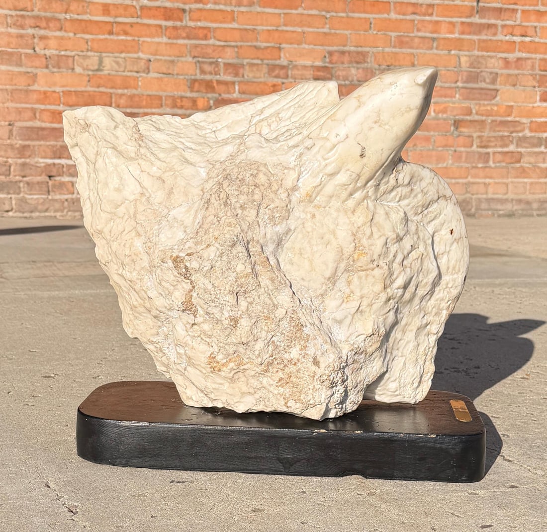 Don Ray Osprey II Marble Carving: Title is Osprey II. 18 1/2" by 5 1/2" by 13". 44lbs 11oz without base. Beak is chipped. Don Ray (1937-2006) Reared on a ranch near Clarendon, Texas, Ray focused on the subjects he grew up with.