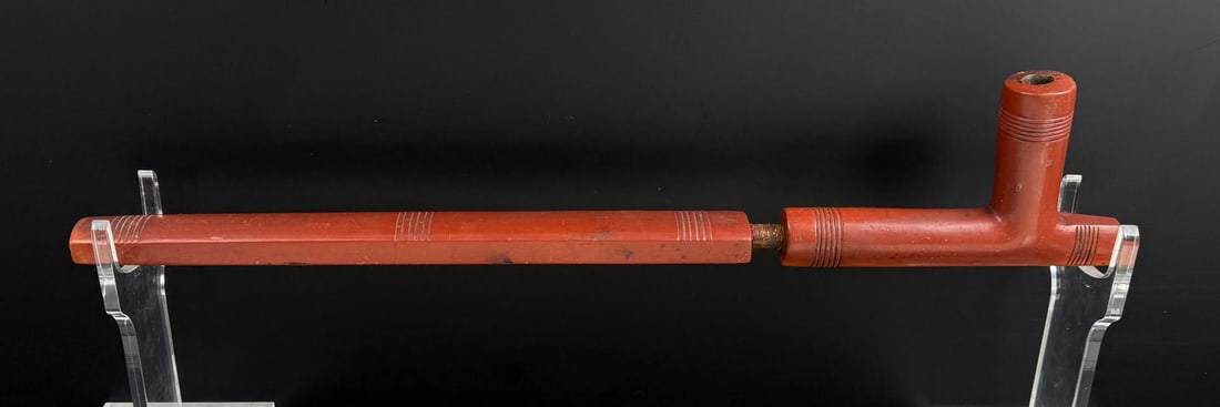 Native American Indian Catlinite Indian Peace Pipe: 21 7/8" long. Old museum numbering on the side. Provenance: The Collection of Bernard Pomerance.