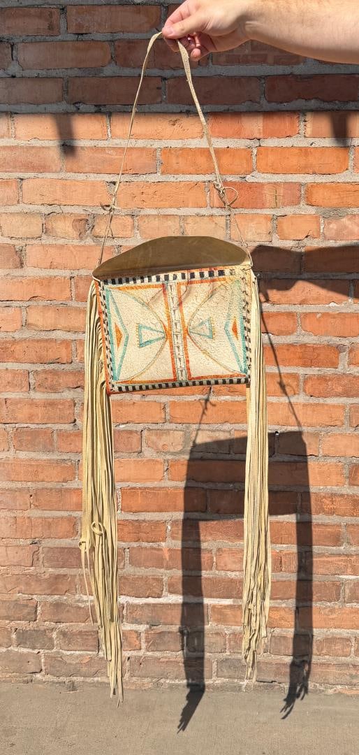 Lipan Mescalero Apache Indian Parfleche Flat Case: Made by Tom Lukomski, second half of the 20th Century. Case is 10 1/2" by 8 3/8". Drop is 32 1/2" long.
