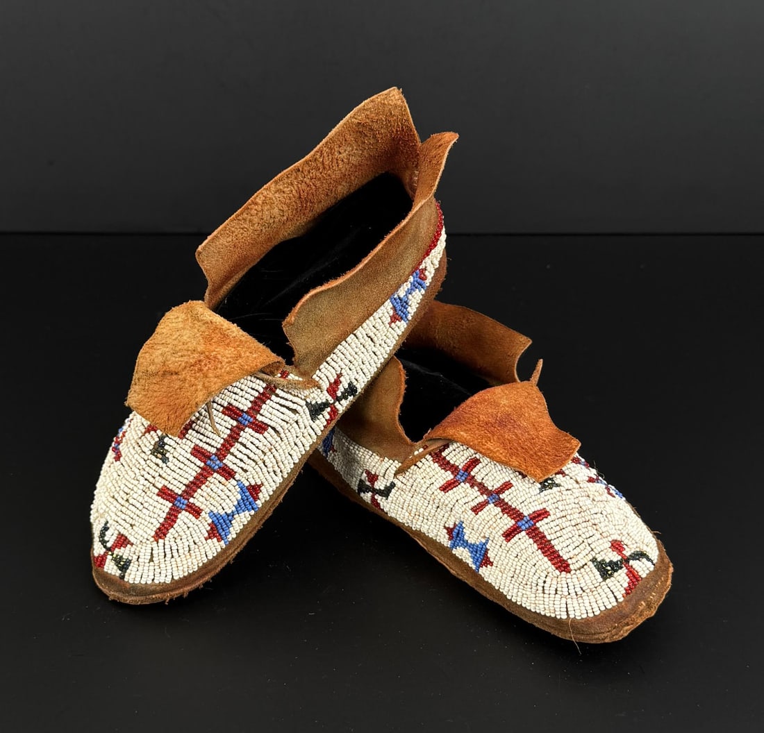 Sioux Native American Indian Beaded Moccasins: 8 1/2" by 3 1/2" by 3 1/4". First Quarter of the 20th Century.
