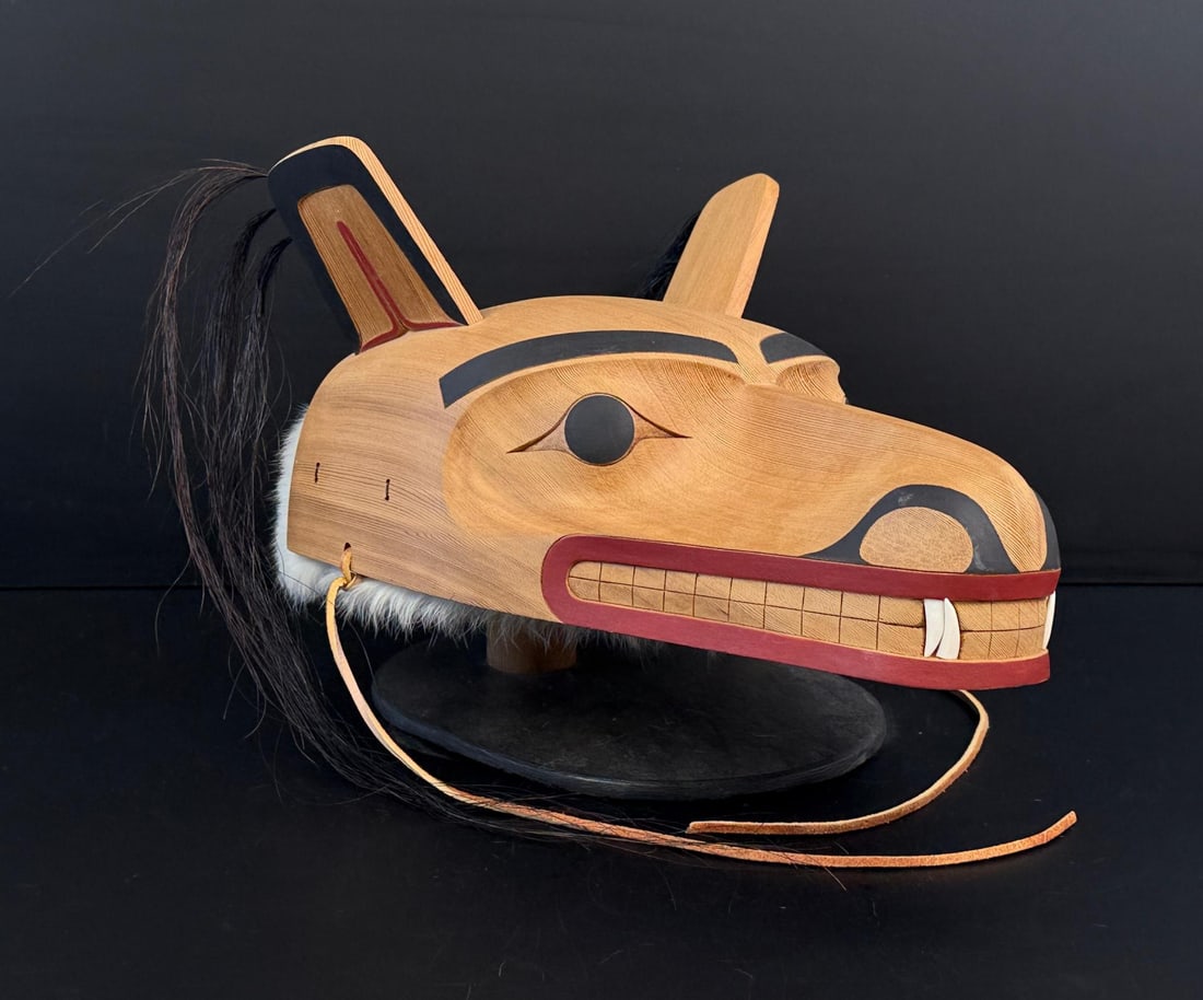 Gerry Dudoward Tsimshian Northwest Coast Mask: Title is Wolf Spirit. 14 1/4" by 13 1/4" by 6 5/8". Gerry Dudoward was an outstanding Tsimshian carver. Over the years he developed a distinctive style, which is characterized by graceful lines and fi