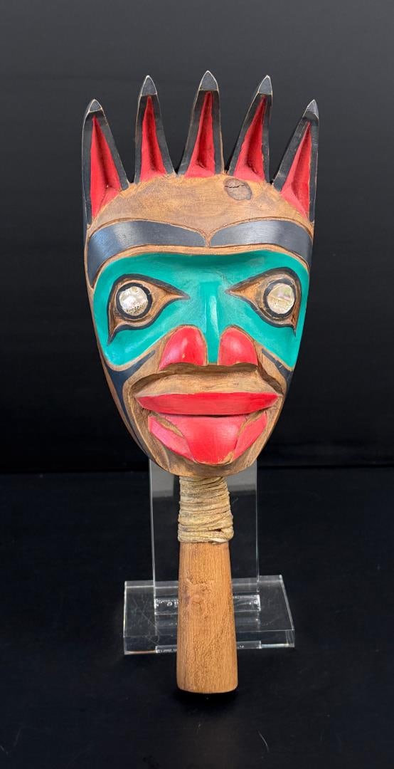 Ivan Otterlifter Northwest Coast Rattle: 11" long. Ivan Otterlifter (1936 - 1999) was active/lived in Canada. Ivan Otterlifter is known for Wood carving, Indigenous symbolism, and ceremonial objects. Ivan Otterlifter was born in 1936 in the 