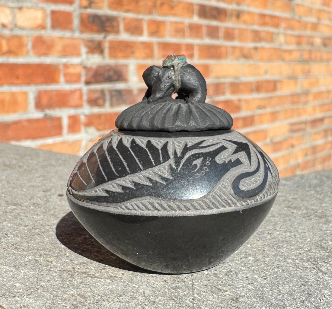 Joseph Lonewolf Santa Clara Pueblo Lidded Jar: 1 7/8" diameter, 1 3/4" tall. Joseph Lonewolf. 1932 - 2014. Known for: Sgrafitto Carved Pottery. Joseph Lonewolf (January 26, 1932 ? November 9, 2014) was a Native American potter from Santa Clara Pue