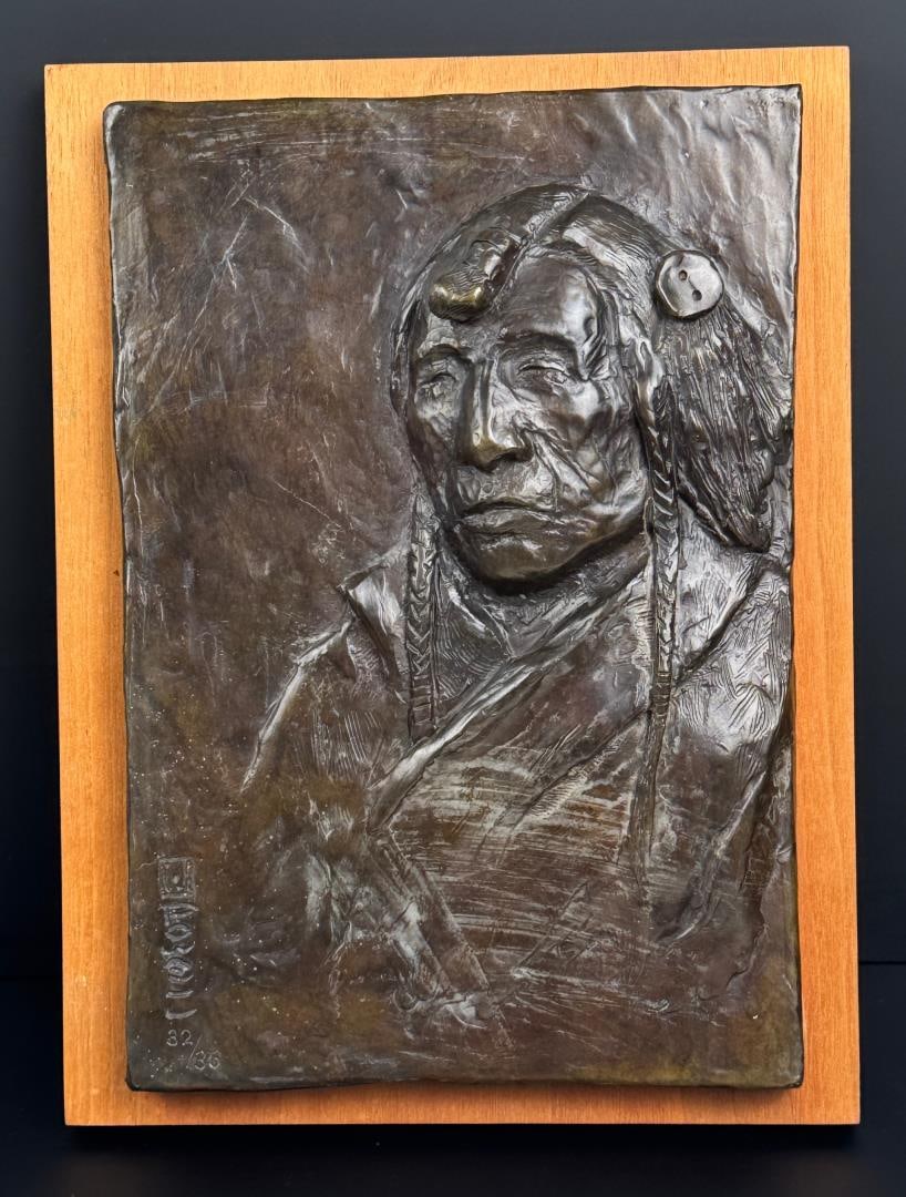 Ace Powell Blackfoot Indian Wall Plaque Bronze: Title is Blackfoot Indian. 2 1/2" by 9" by 12". Edition 32/35. Ace (Asa Lynn) Powell (1912 - 1978) was active/lived in Montana, New Mexico. Ace Powell is known for Cowboy genre and Indian figure paint