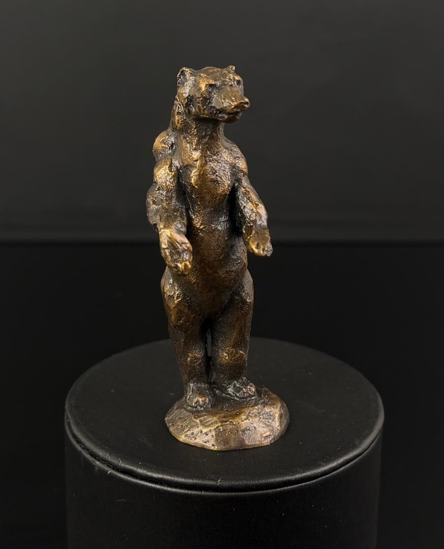 Daro Flood Alert Bear Bronze: Title is Alert Bear. 1 3/8" by 1 3/8" by 5 3/8". Number 14/20. Daro Flood (1954 - 2017) was active/lived in Arizona. Daro Flood is known for Portrait bust Indian and cowboy sculpture. Daro Flood was a