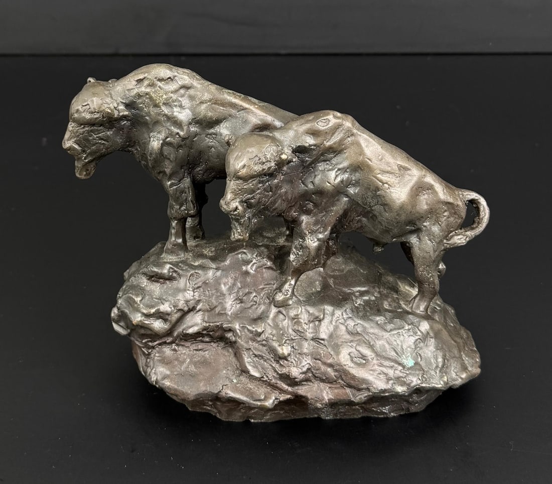 Charles M Russell Buffalo Bronze: Title is Buffalo. 6 1/2" by 5 1/8" by 3 1/2". Charles Marion Russell (1864 - 1926) was active/lived in Montana, California, Missouri. Charles Russell is known for Indian-frontier genre painting, sculp