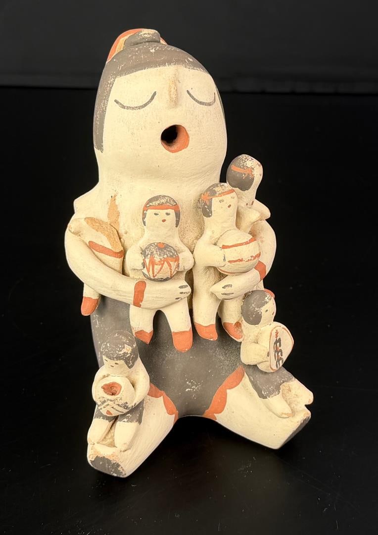 Marie Toya Jemez Pueblo Storyteller: One child has been decapitated. 5 1/2" by 4 1/4" by 3 1/2"