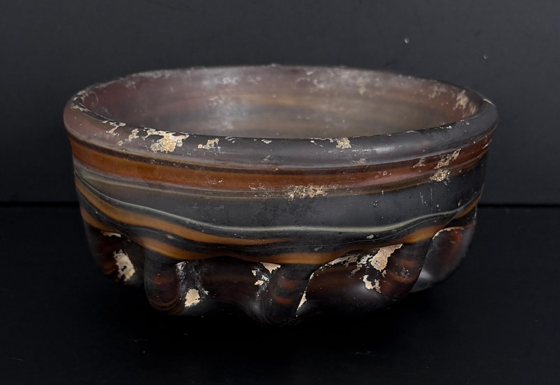 Ancient Roman Ribbed Marbled Glass Bowl: Circa 1st Century AD. 5 1/8" diameter, 2 1/4" tall. Provenance: Stanley Batkin, New York, acquired in 1979. Thomaston Place Auction Galleries, Thomaston, Maine, Summer Auction Weekend, 27 August 2017,