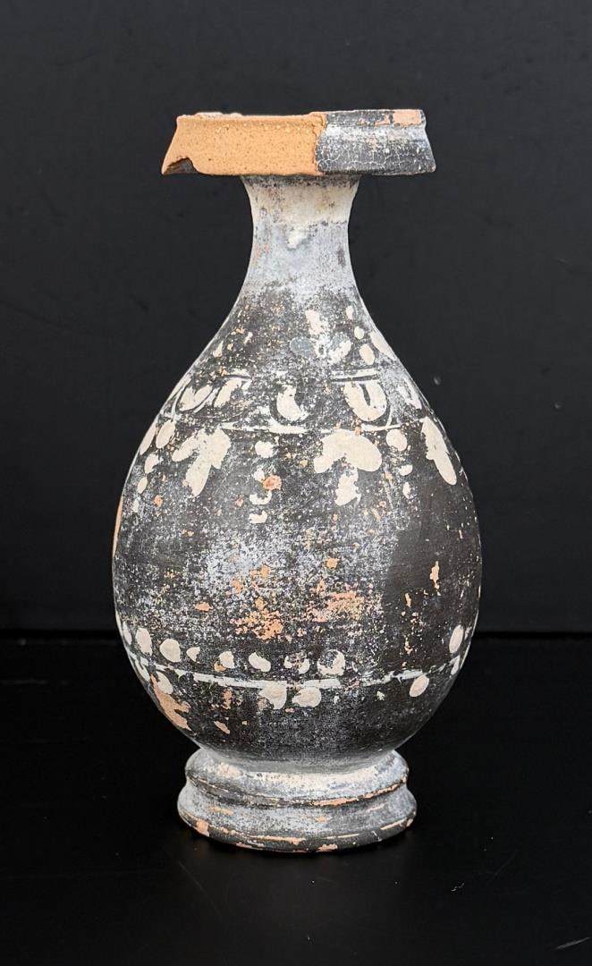 Ancient Greek Gnathian Ware Terracotta Lekythos: 5" tall, 2 5/8" diameter. Circa 4th Century BC. Provenance: Iris Cornelia Love Collection (1933-2020), New York, primarily formed in the 1950s-1970s. Iris Cornelia Love (1933?2020) was an American arc