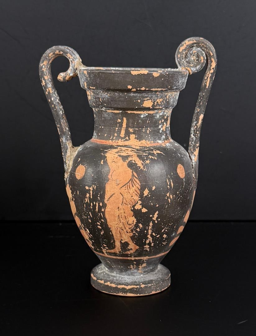Ancient Greek Apulian Attic Black Volute Krater: 5 1/2" tall, 2 7/8" diameter. Repair and loss as shown. Provenance: Iris Cornelia Love Collection (1933-2020), New York, primarily formed in the 1950s-1970s. Iris Cornelia Love (1933?2020) was an Amer