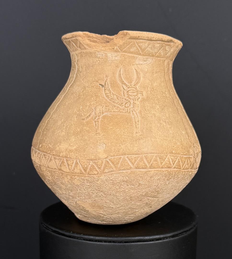 Ancient Anatolian Jar with Winged Deer: 3 1/2" by 3 1/4" by 3 1/8". Chipped as shown. Provenance: Iris Cornelia Love Collection (1933-2020), New York, primarily formed in the 1950s-1970s. Iris Cornelia Love (1933?2020) was an American archa