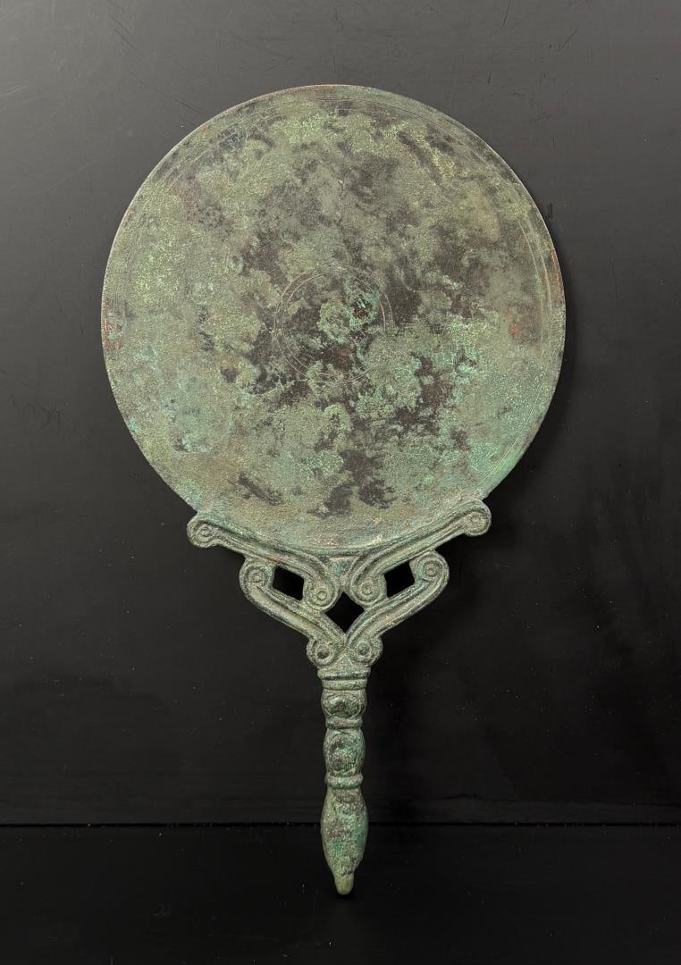 Ancient Roman Bronze Mirror: 13" by 8". Roman, 3rd century AD. Provenance: Lemani Gallery, Staten Island, New York, Asian Antiques From Estates and Collections, 27 January 2018, Lot 351. European private collection (1975?1991)